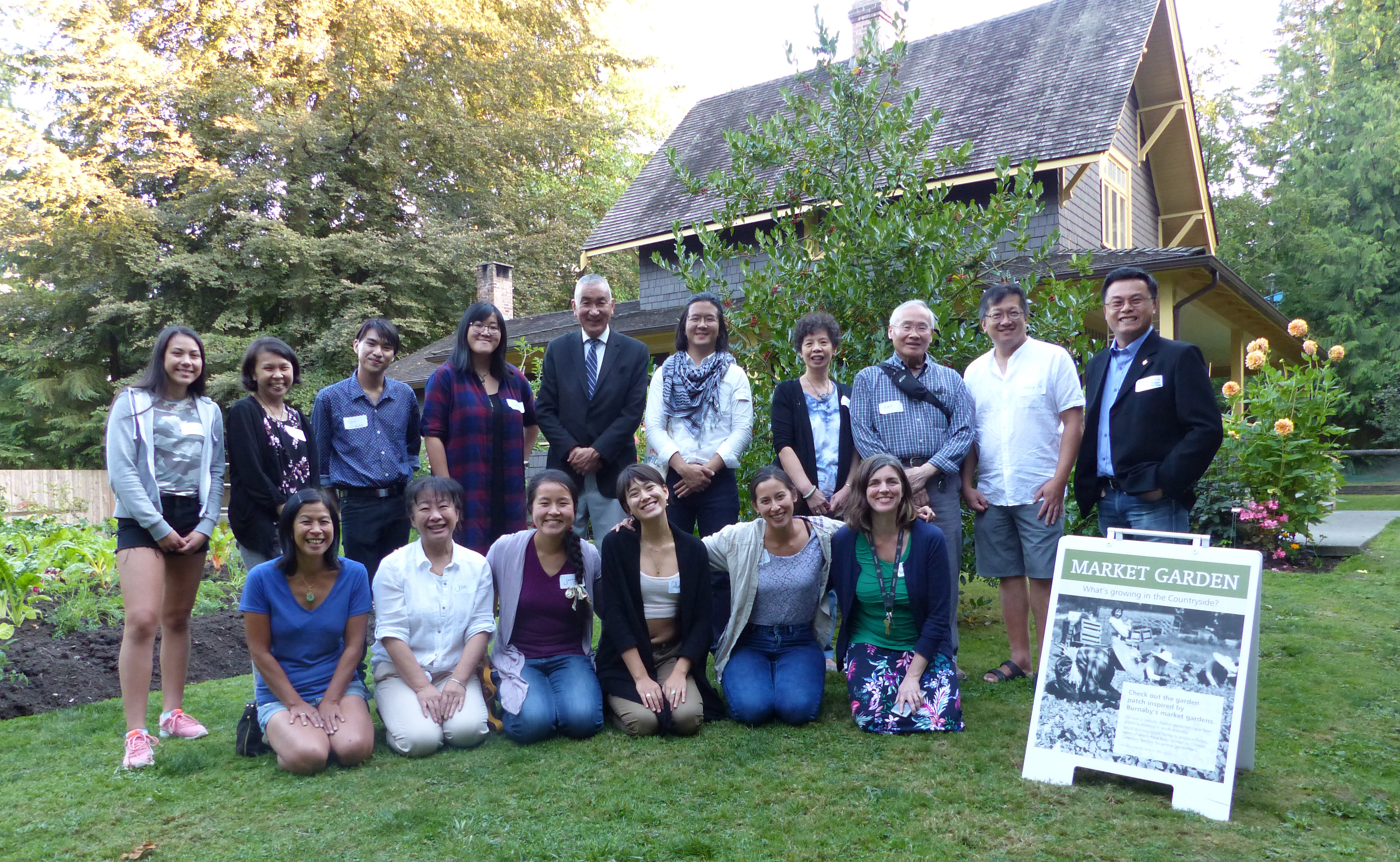 A group of faculty, staff, students, and community members outside at the Burnaby Village Museum