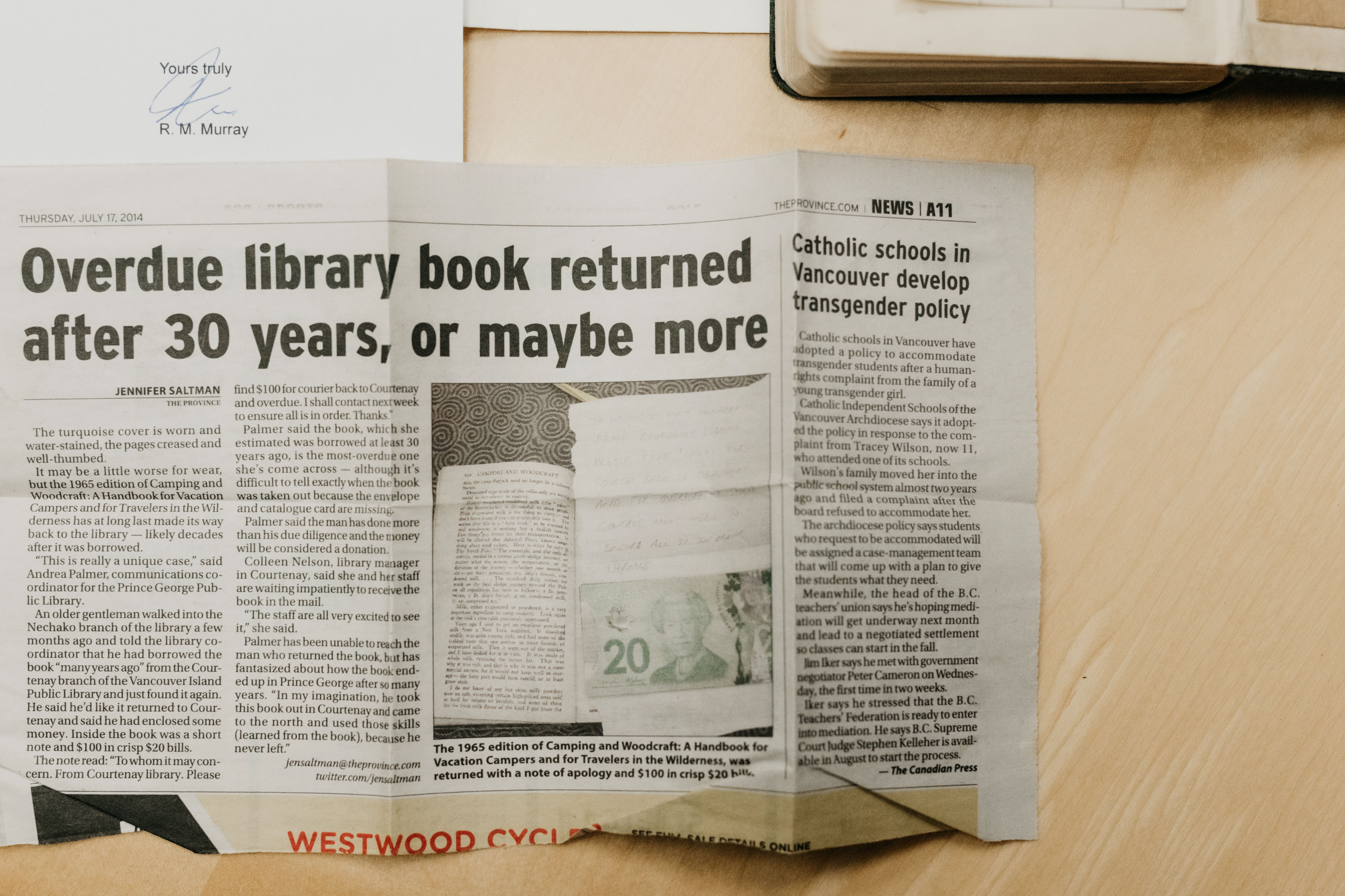 Newspaper clipping: "Overdue library book returned after 30 years..."