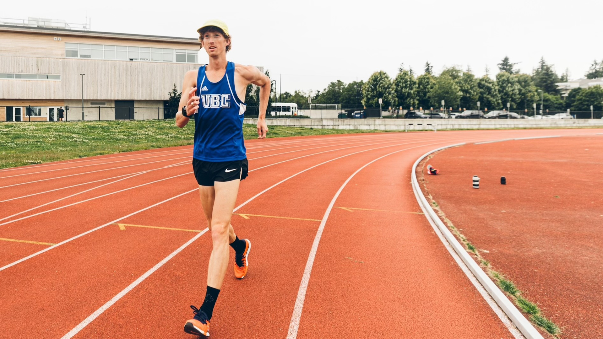 Evan Dunfee race walking on a track outdoors