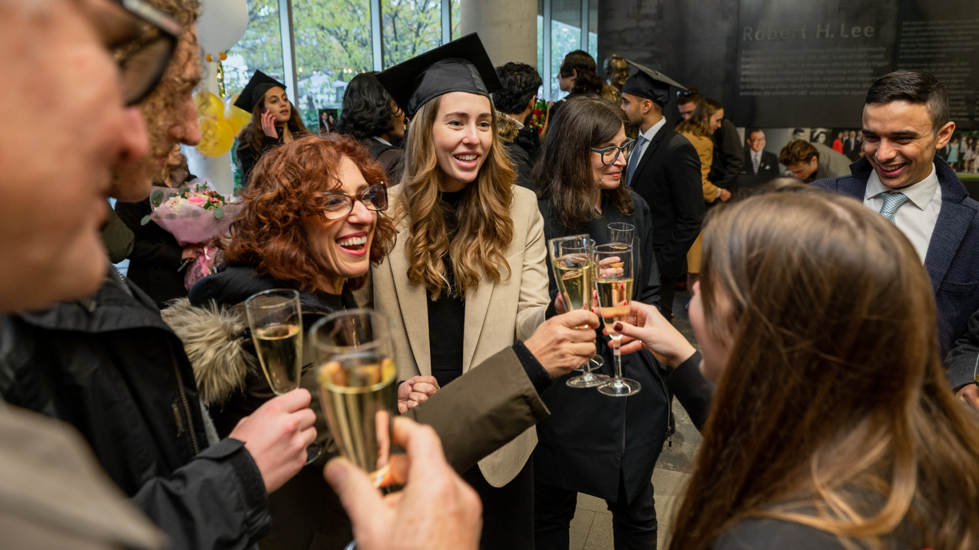 UB graduates celebrating at the graduation afterparty at Robert H. Lee Alumni Centre
