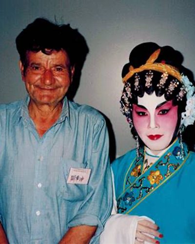 Wah Kwan Gwan (left) photographed with a Cantonese opera performer
