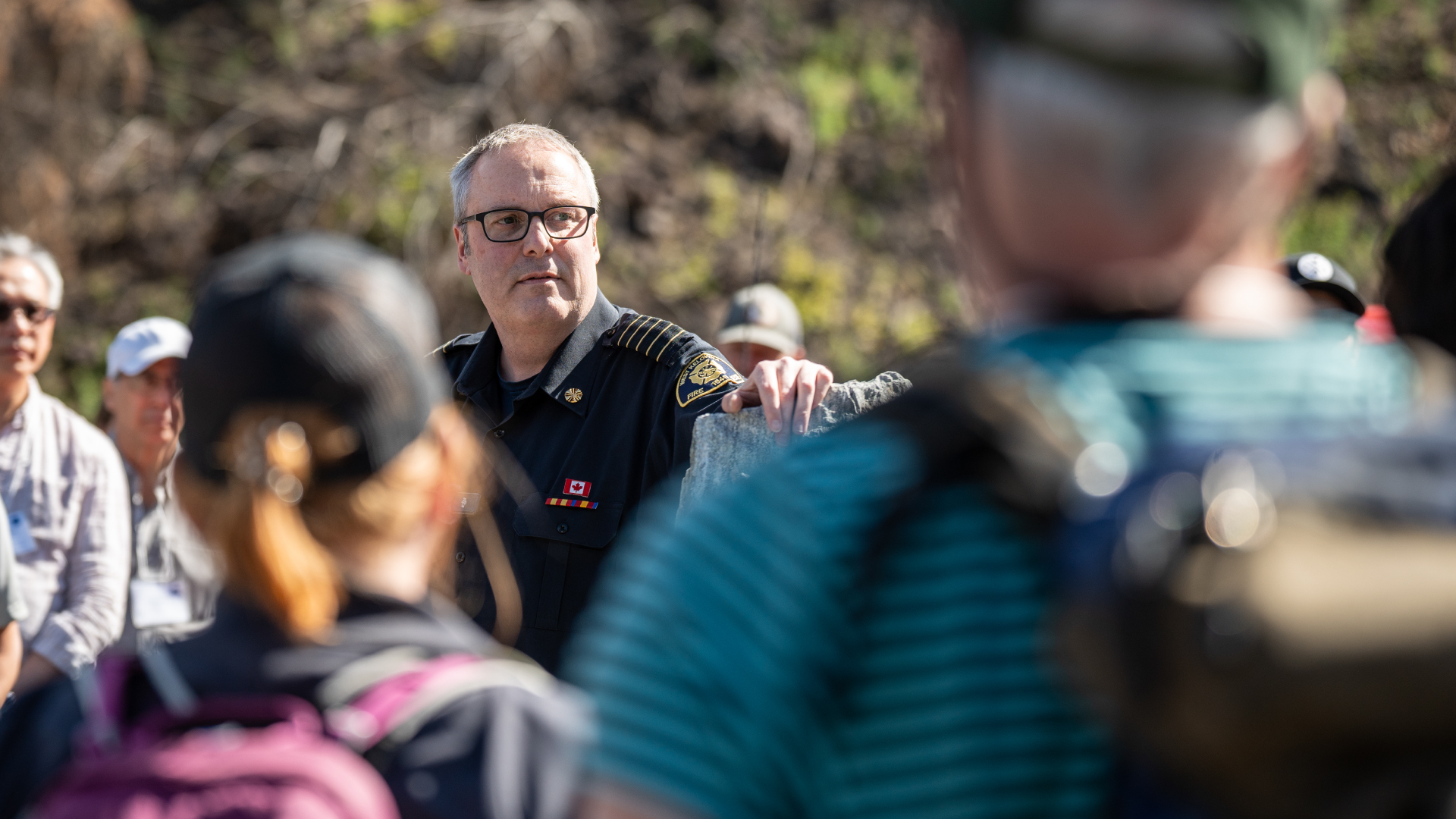 West Kelowna Fire Chief Jason Brolund standing in crowd