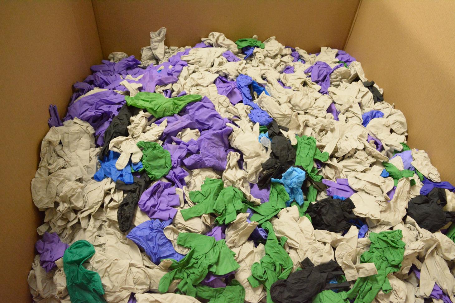 Box filled with disposable plastic gloves