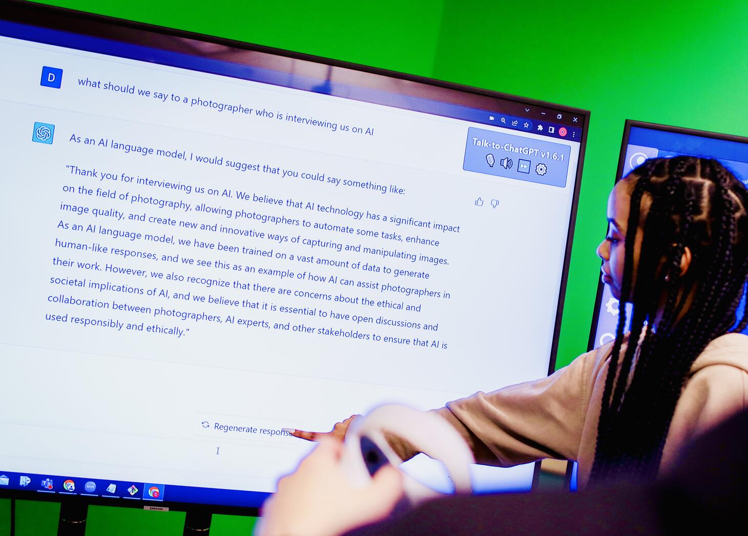 Young woman pointing at words on a screen