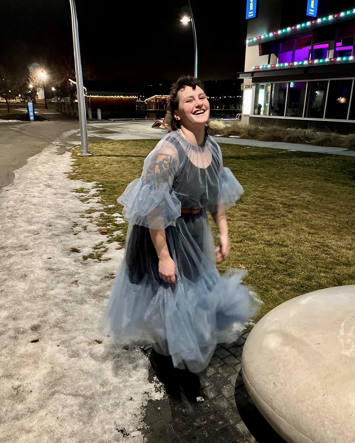 Erin Scott smiling in a blue dress