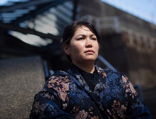 Friba Rezayee wearing a dark blue flowered robe.