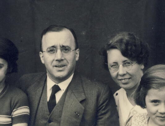 Parents with two girls in black and white photo