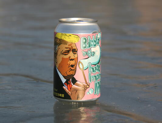 Beer can (with illustration of Trump) sitting on water
