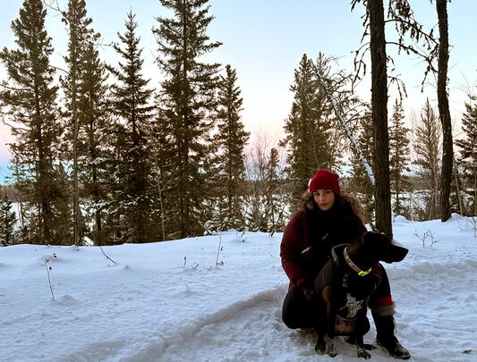 Rohma Khurram Nawaz with her dog Saiya on a snowy day
