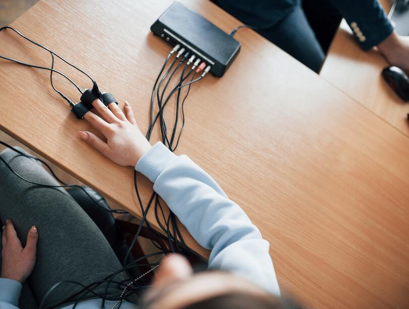Overhead shot of a person taking a lie detector test