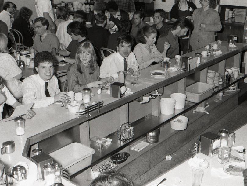 Black and white photo of UBC students in a cafeteria.