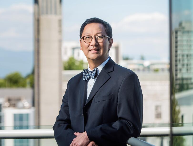 Headshot of Santa J. Ono smiling.