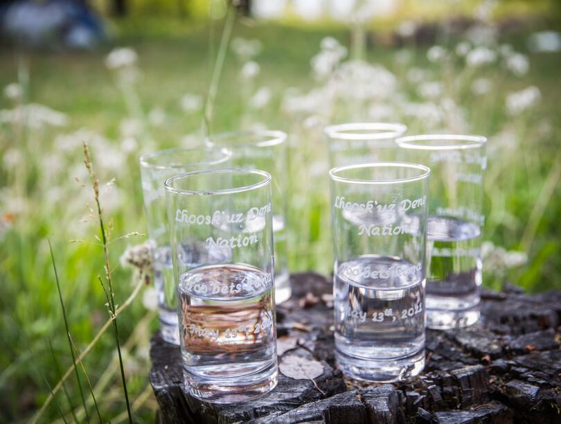 Glasses engraved with 'Too bets`huna,' meaning ‘We live by water’ 
