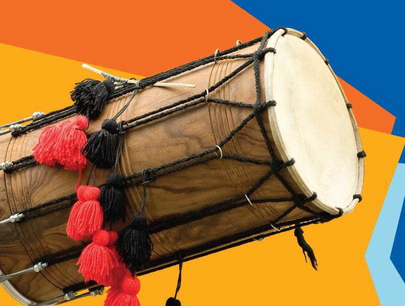 Photo of a drum against a yellow, orange and blue background.