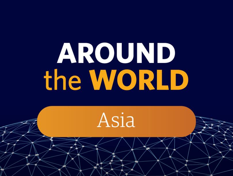 Navy and orange illustration of Around the World Asia text.
