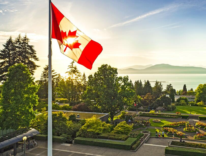 Wide-angle semi-aerial shot of the Rose Garden, with the Canadian flag on the left