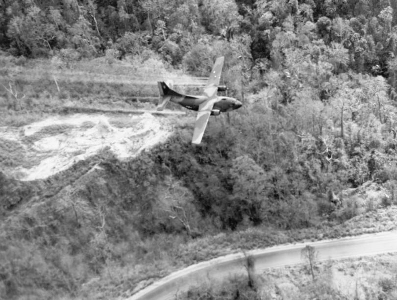 Airplane spraying a roadside in South Vietnam in 1966. 
