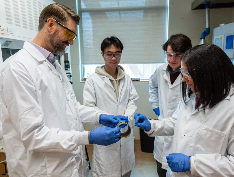 Dr. Yasmine Abdin (right) and her collaborators in lab wear at UBC.