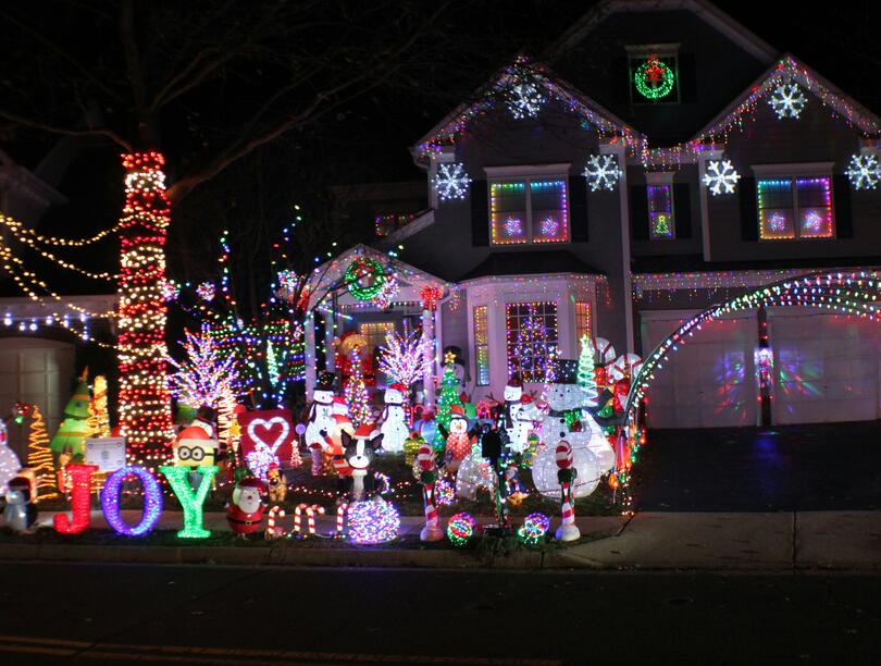 Excessive holiday lights display in front of house