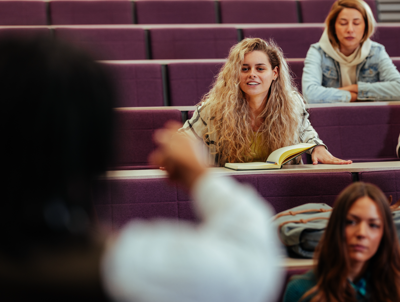 University students seated in a classroom facing an instructor