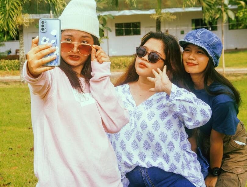 Three young women taking a selfie together