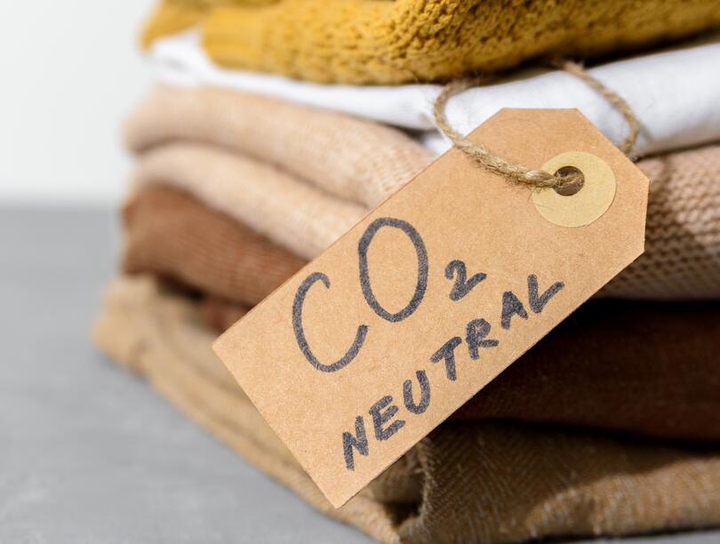 Stack of fabrics with tag stating "CO2 NEUTRAL"