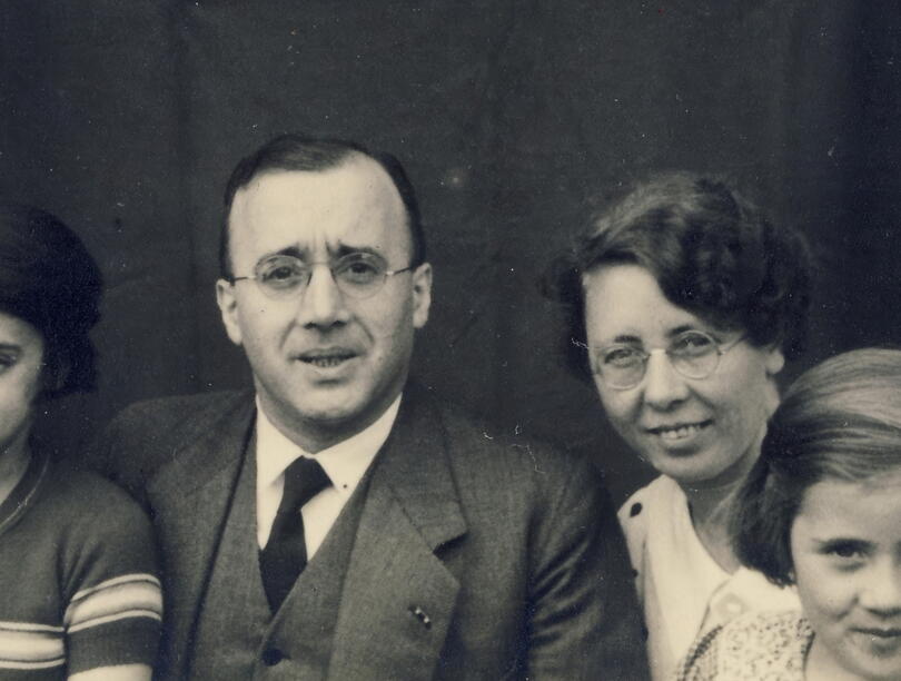 Parents with two girls in black and white photo