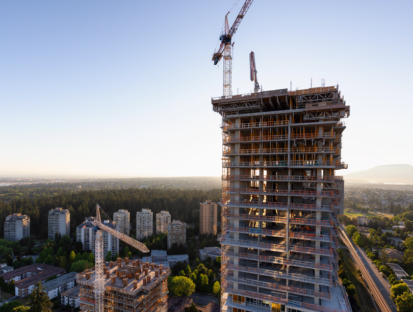 High-rise under construction rising above cityscape