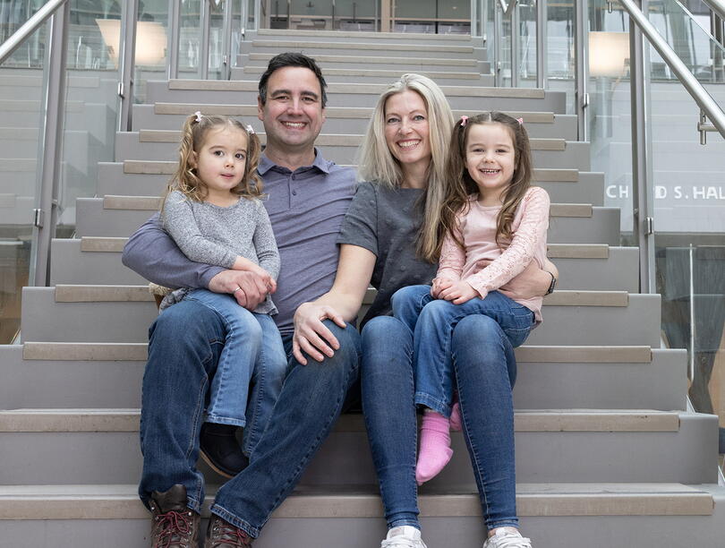 Portrait of James Seabrook and his family seated on a set of stairs