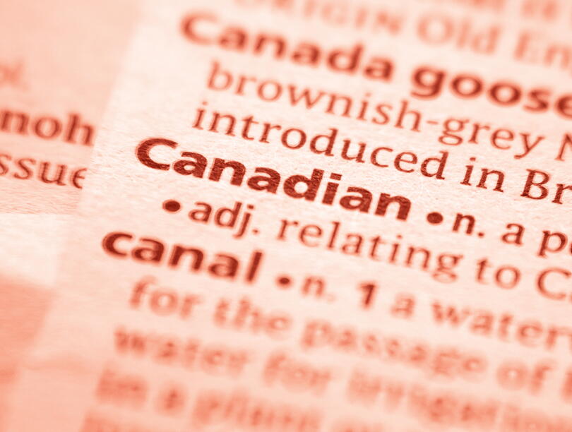 Close-up of "Canadian" entry in dictionary, with red overlay