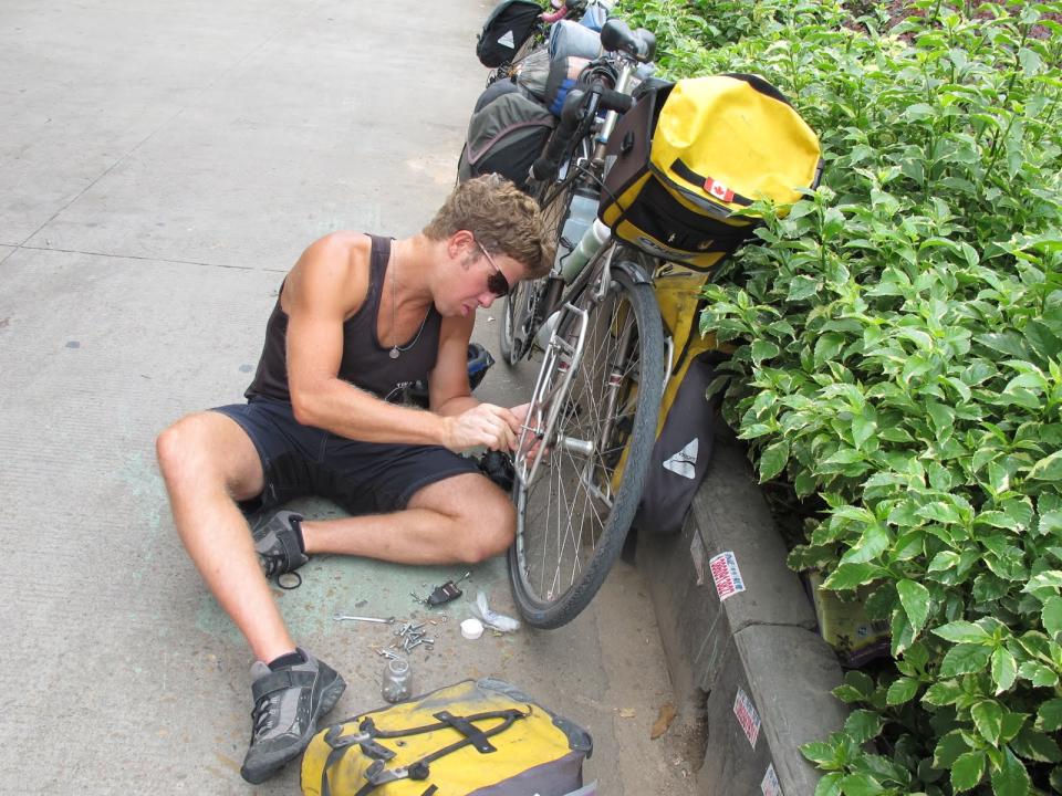 Fixing my front pannier rack on side of road in China