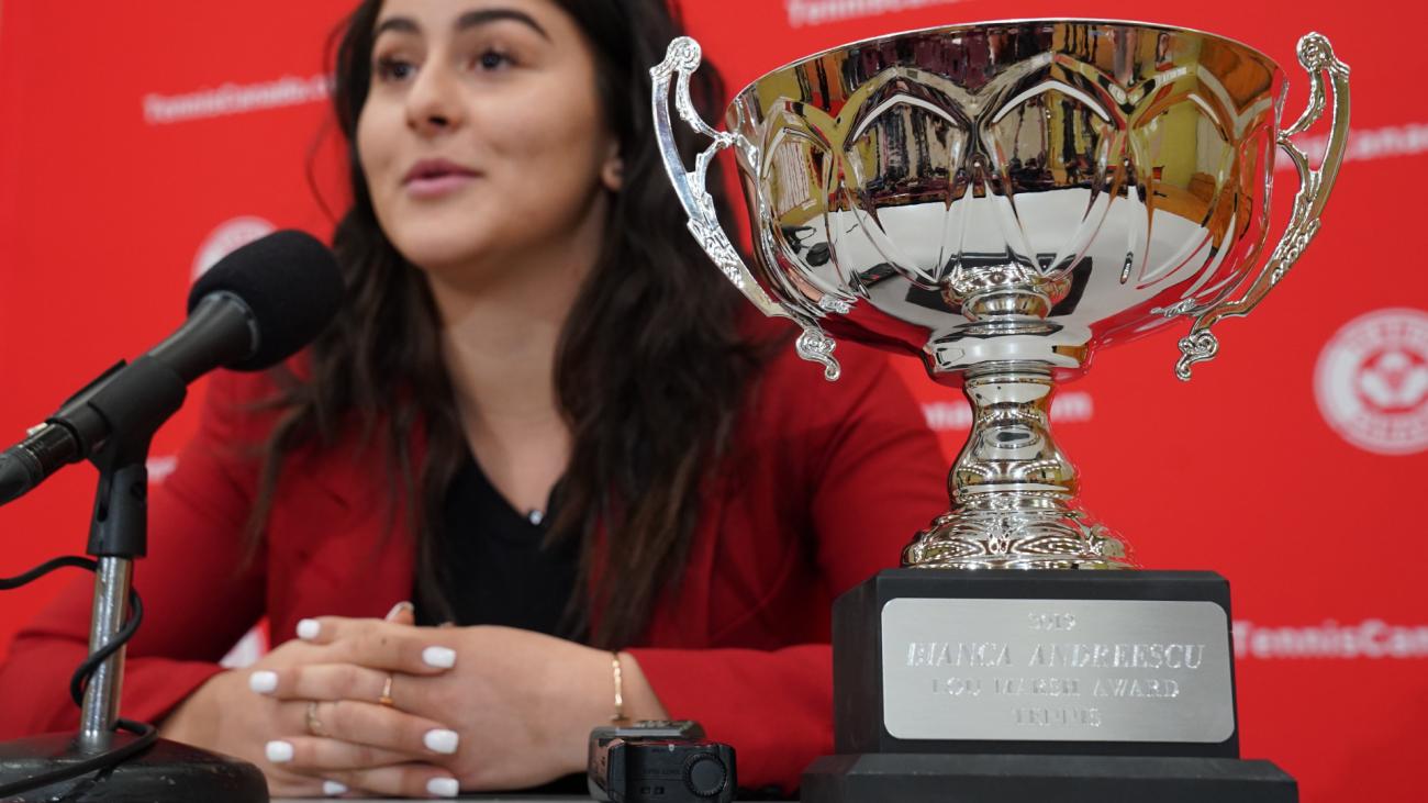 Bianca Andreescu speaks at a media conference beside the Lou Marsh Trophy 
