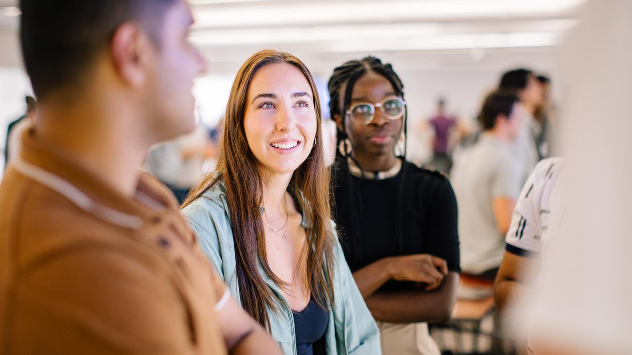 Three UBC students standing and smiling