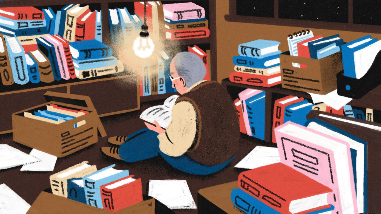 An illustration of a man with grey hair sitting in a room at night, surrounded by piles and boxes of books.