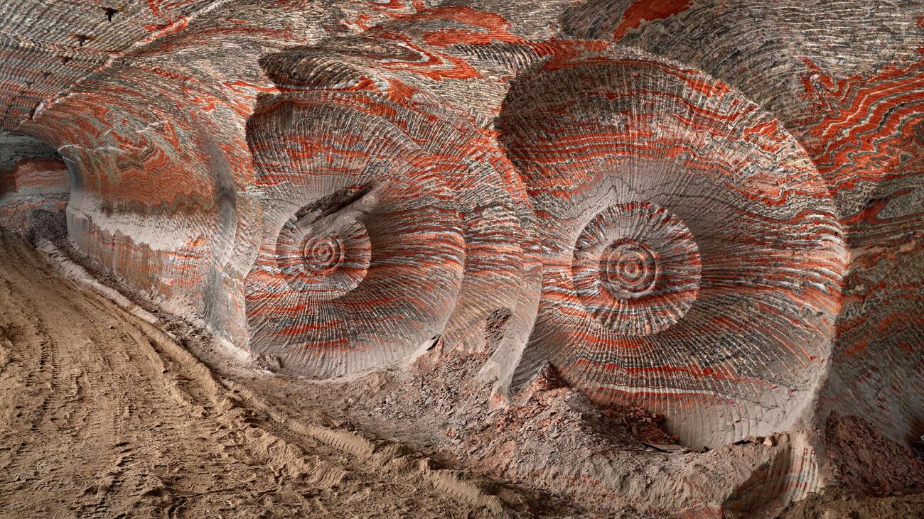 The Uralkali Potash Mine: spiralling swirls of earth like nautilus shells, shot through with streaks of red.