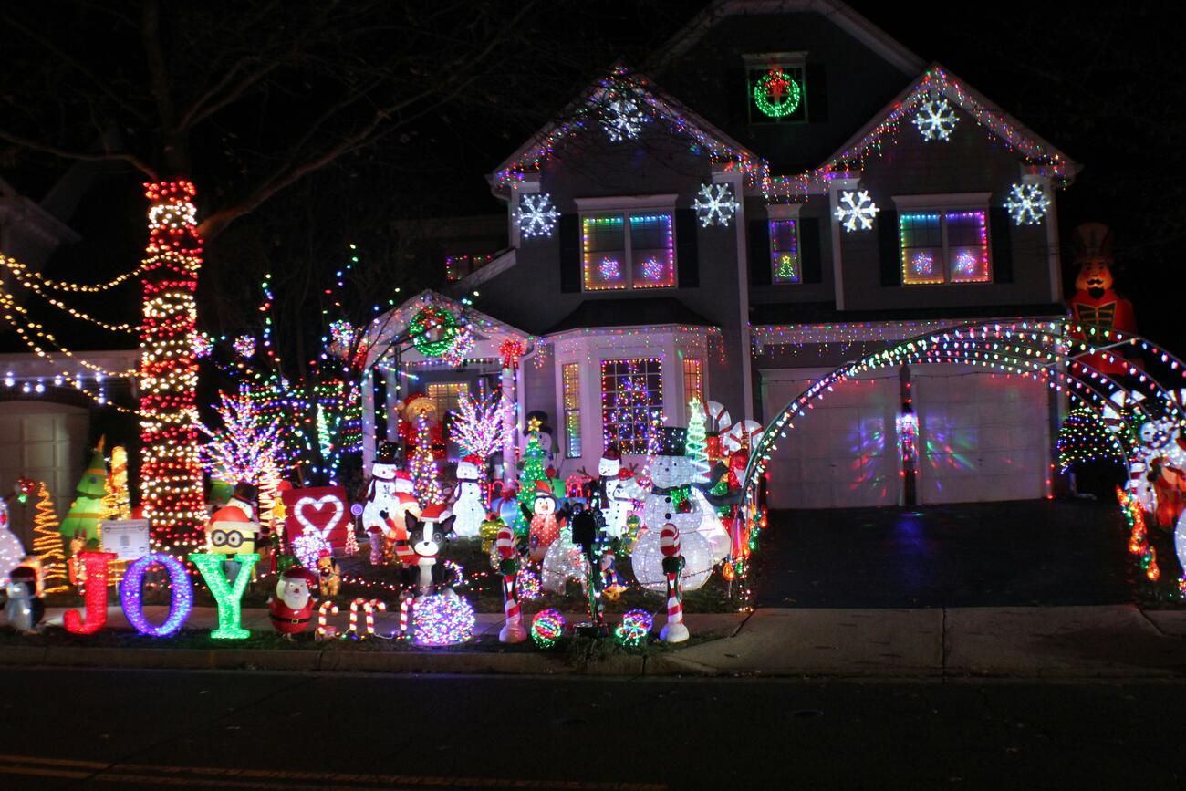 Excessive holiday lights display in front of house