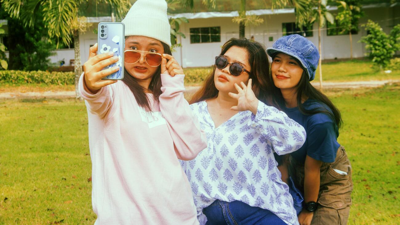 Three young women taking a selfie together