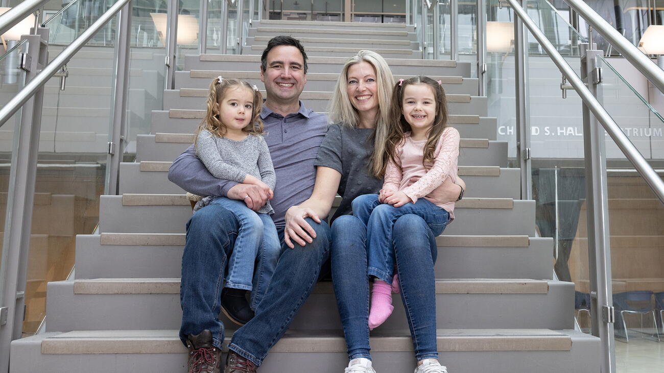 Portrait of James Seabrook and his family seated on a set of stairs