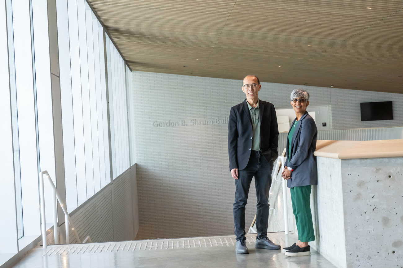 Man and woman stand at top of stairwell