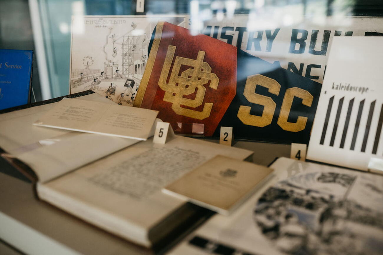 Books and paraphernalia in a display case