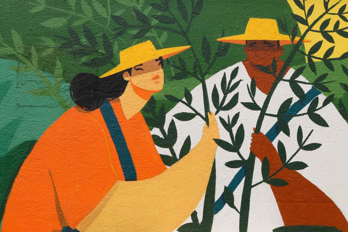 Shot of a colourful mural depicting two coffee farmers