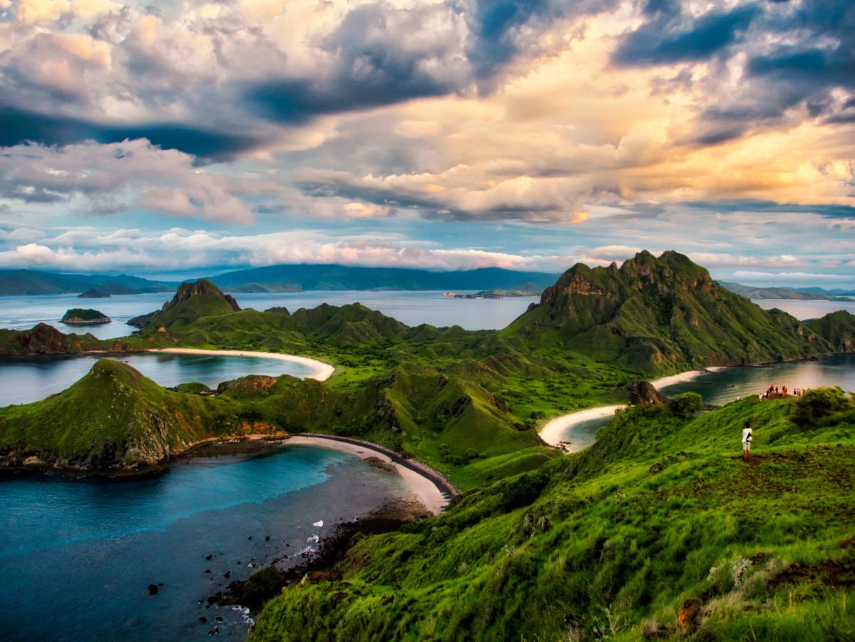 A wide-angle shot of an island in Indonesia, with views of water and greenery