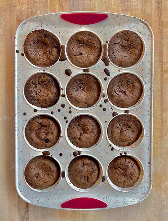 12-hole muffin baking tray filled with mochi brownies