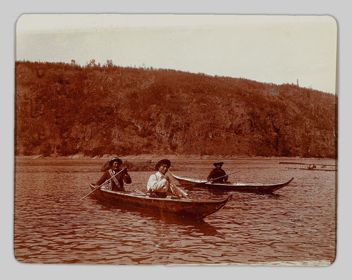 Two miners in a canoe.