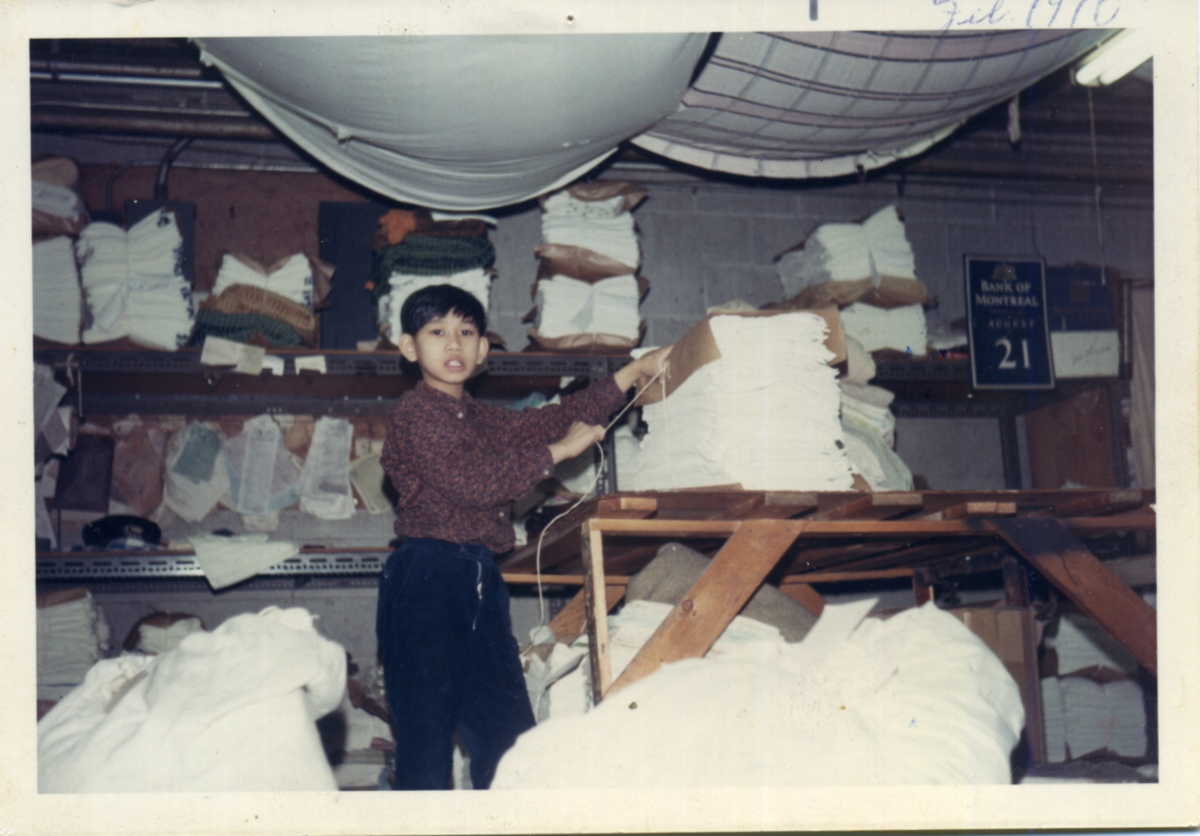 Elwin Xie as a kid, working inside Union Laundry