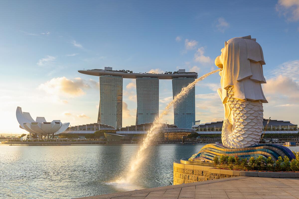 Marina Bay Sands in the distance, with water and a fountain in the foreground