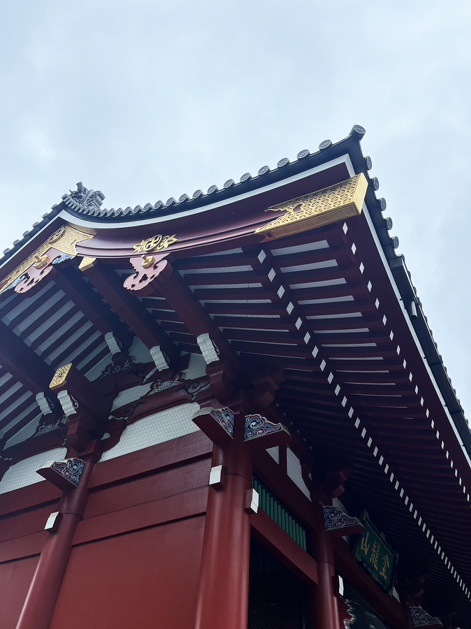  A close-up shot of a building showing its traditional design and ornamental roofline