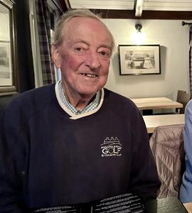 A photo of Richard Thomas Holt wearing a dark blue Annapolis Royal Gold & Country Club sweatshirt.