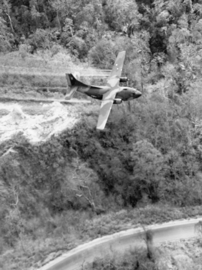 Airplane spraying a roadside in South Vietnam in 1966. 