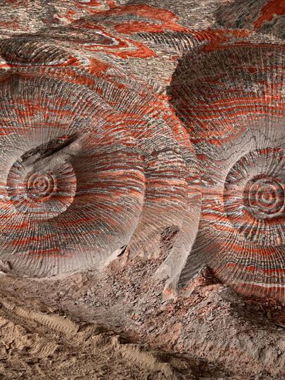 The Uralkali Potash Mine: spiralling swirls of earth like nautilus shells, shot through with streaks of red.